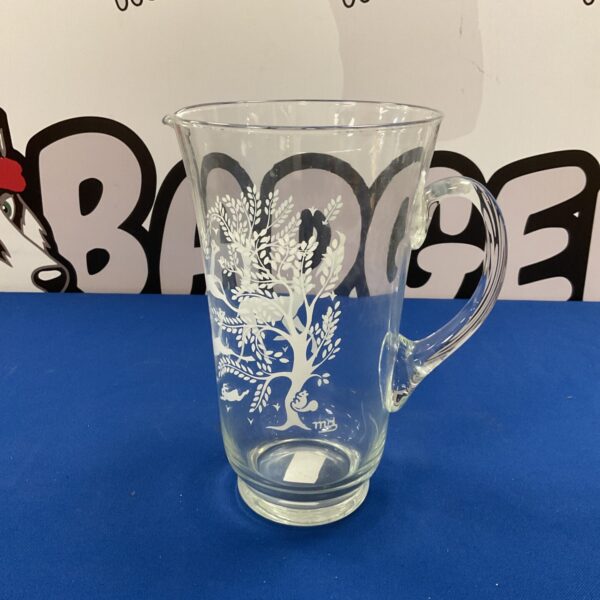 Vintage mid century serving pitcher with woodland animal design.