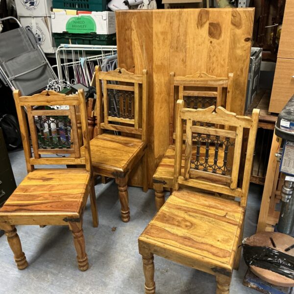 Rustic Indian oak dining set with wrought iron chairs.