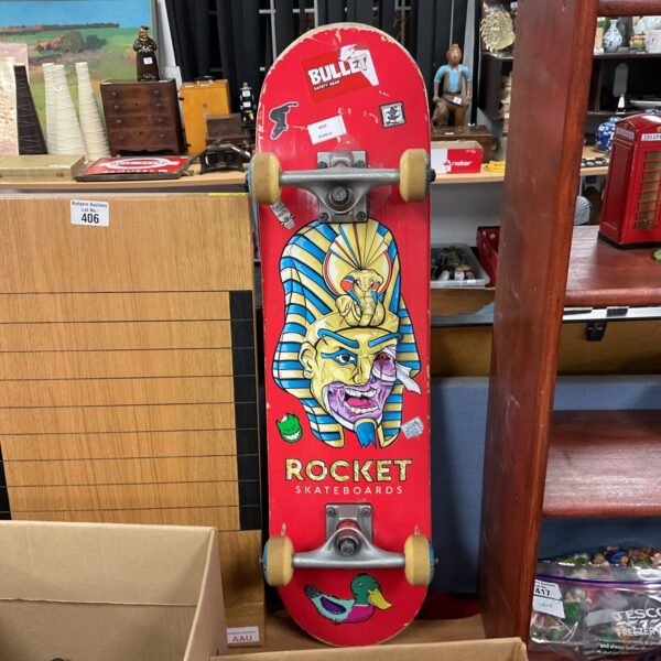 Vintage Rocket skateboard with Egyptian mummy graphic.