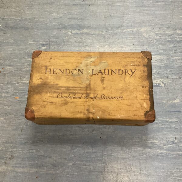 Vintage Hendon laundry box with wooden construction and visible lettering.