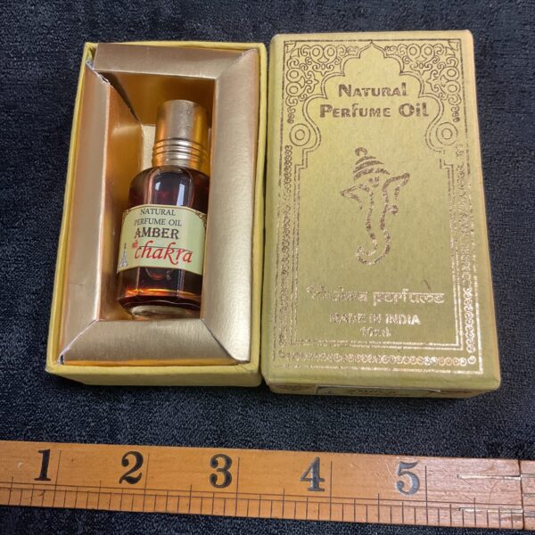 Shakara Amber perfume oil in decorative gift box.