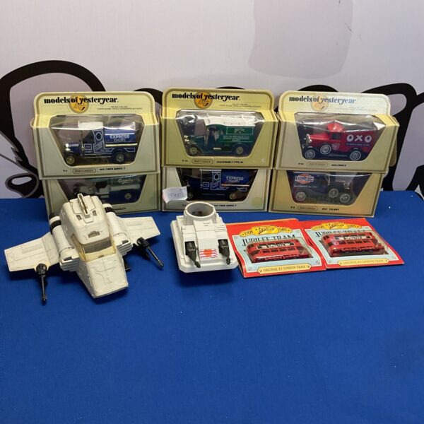 Boxed lot of vintage diecast model cars and Star Wars ships.