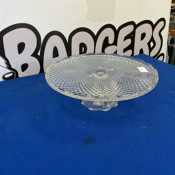 Elegant vintage cut glass cake stand for displaying desserts.