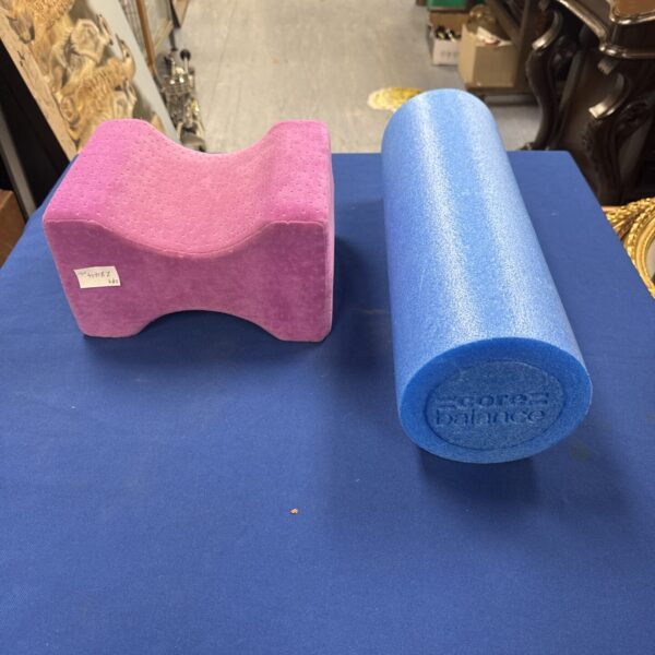 Core balance roller with knee pillow for fitness exercises.