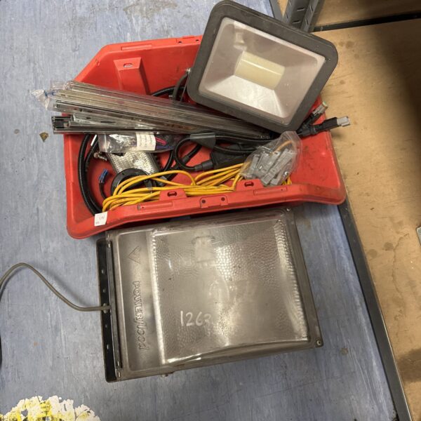 Mixed lot of security lights and garage tools for sale.