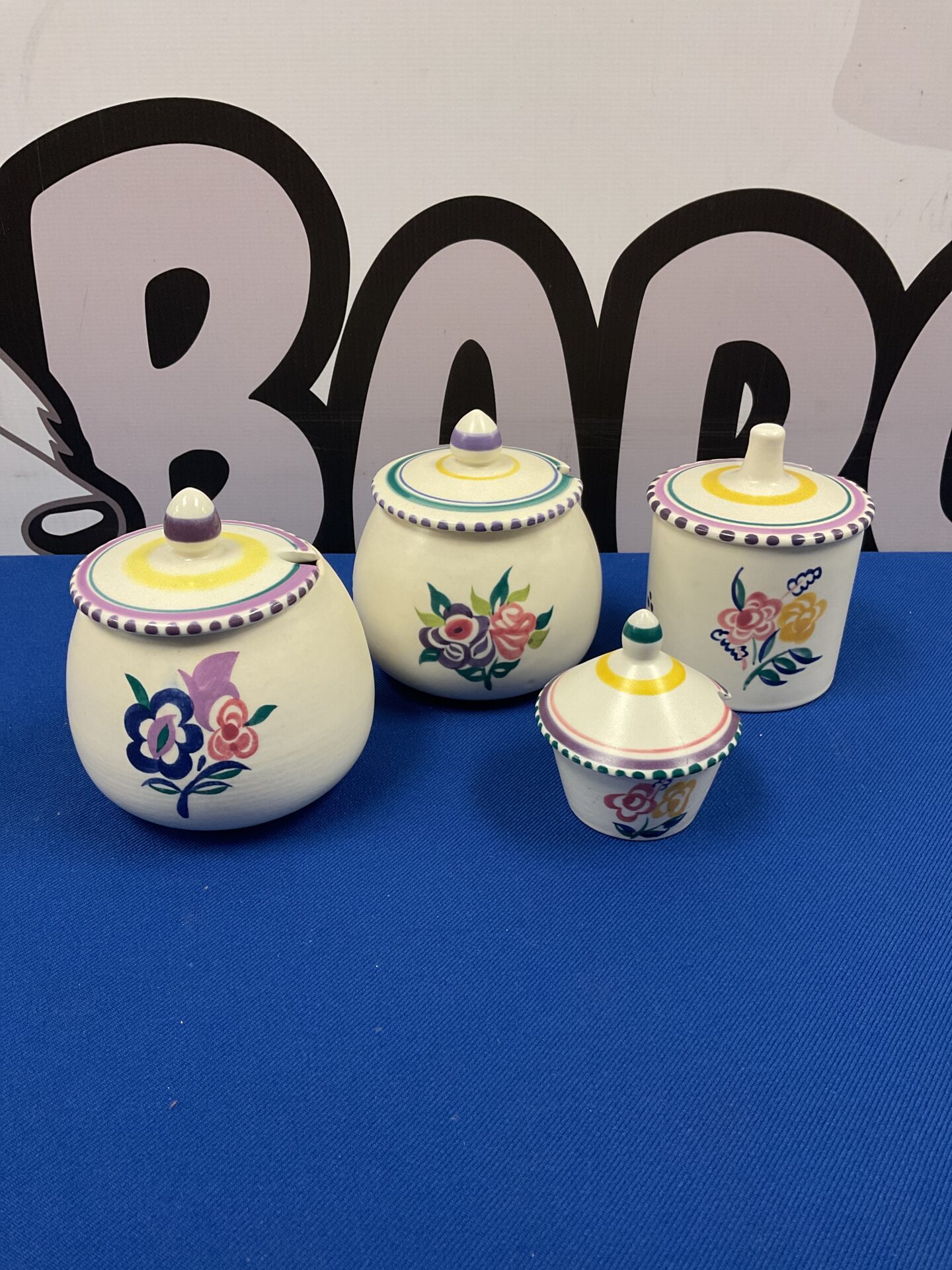 022 Four poole pottery lidded preserve jam pots