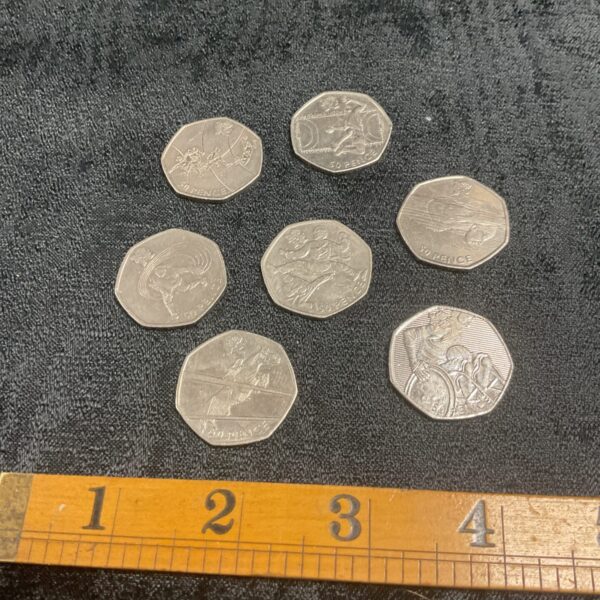 Lot of seven 2011 Olympics 50p coins for collectors.