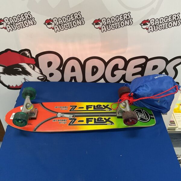 Vintage Z-flex Jay Adams skateboard with vibrant graphic design.