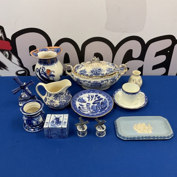 Vintage blue and white porcelain collection with serving dishes and vases.