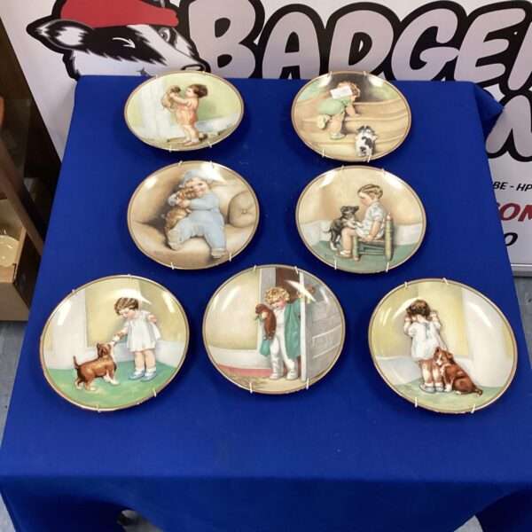 Vintage Bessie Pease wall plates featuring children in a nursery scene.