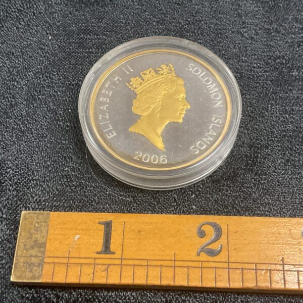 Solomon Islands silver and gold proof coin featuring Queen Elizabeth II.
