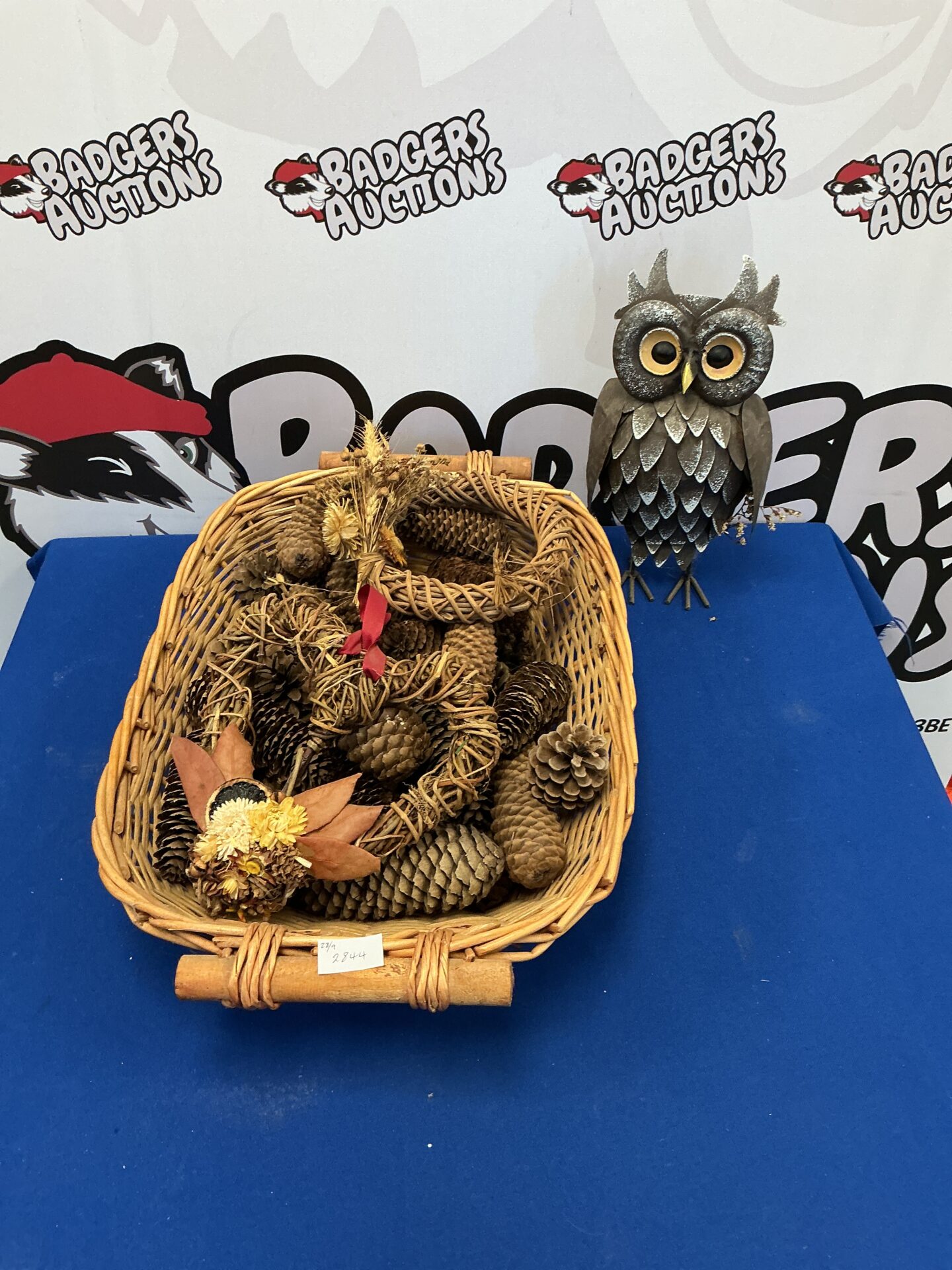 277 Basket of Pine cones with Metal Owl Figurine