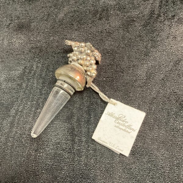Vintage Alessandro Cadtellani silverplate bottle stopper with Art Deco design.