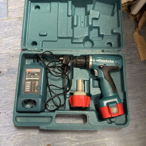 Vintage Makita cordless drill set in original case.