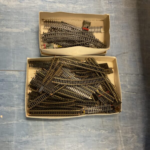 Mixed HO gauge railway track sections in two boxes.