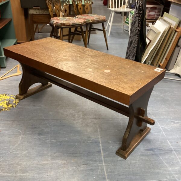 Vintage 1970s hammered copper table with wood base.