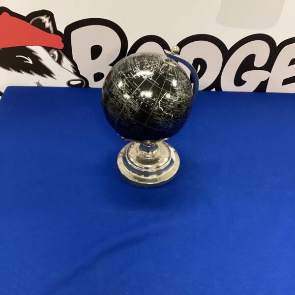 Detailed desktop globe on stainless steel base for office or home.