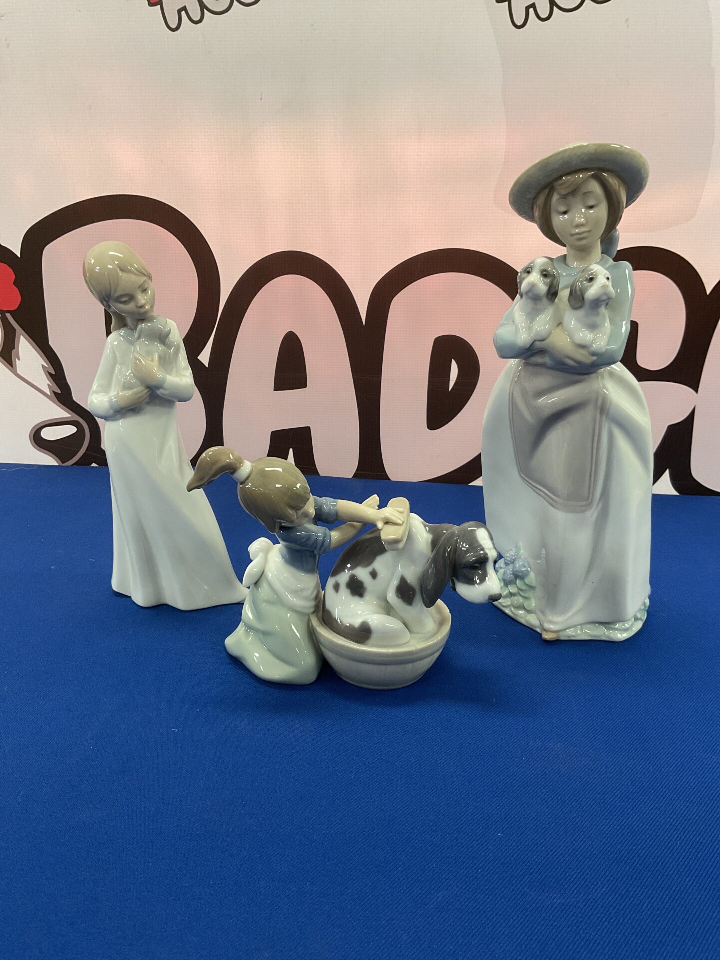 935 Two Lladro Figures with dogs and a girl nao figure