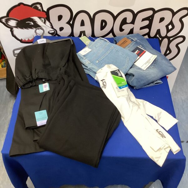 Second hand clothes bundle with Kookaburra shirt and children's items.