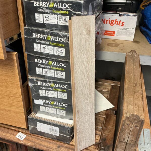 Stack of eleven boxes of Berry Alloc Chateau laminate flooring.