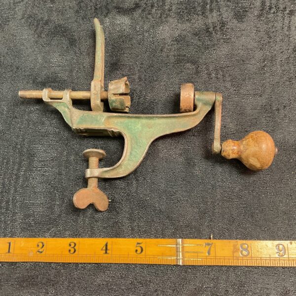 Vintage iron cartridge maker tool for reloading shotgun shells.