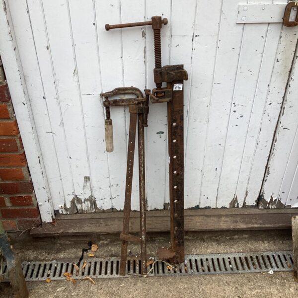 Lot of three vintage metal sash clamps for woodworking.