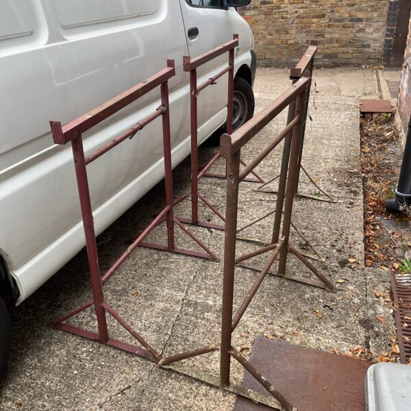 Set of four metal builders tressels for construction and DIY.