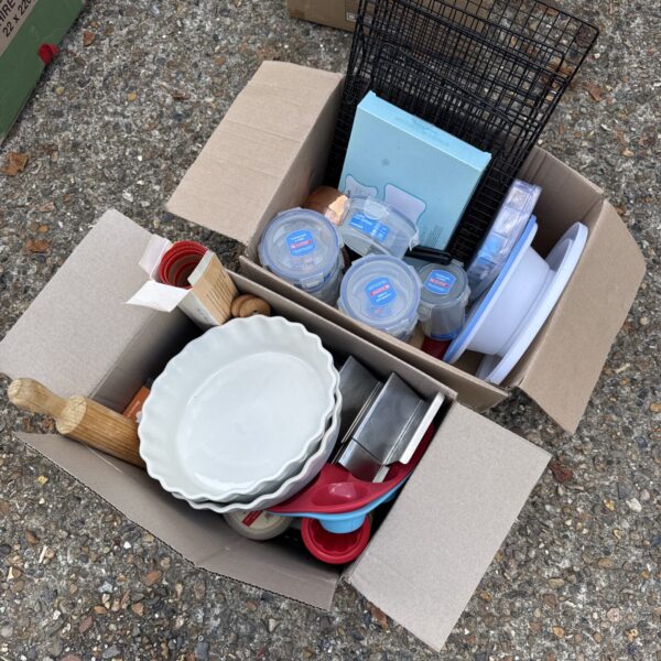 Overview of a vintage kitchen baking lot with pie plates and measuring cups.