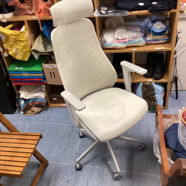 White Ikea office chair with swivel base and adjustable height.