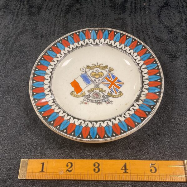 Vintage Franco British Exhibition ash tray with flags and crest.