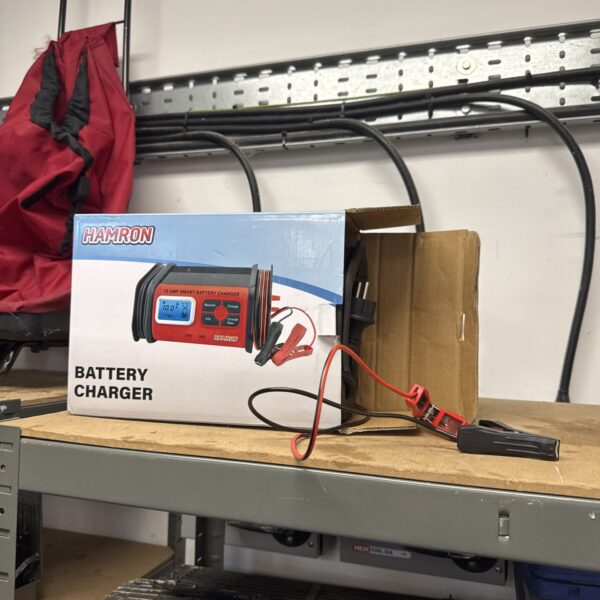 Harmon 10 amp car battery charger with two-pin plug.