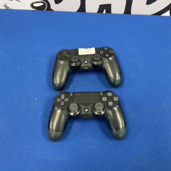 Two used Sony Playstation 4 Dualshock 4 controllers for gaming.