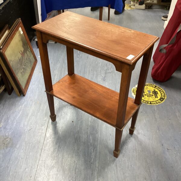 Antique mahogany occasional table with turned legs.