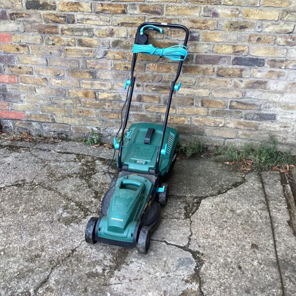 McGregor electric lawn mower in a garden setting.