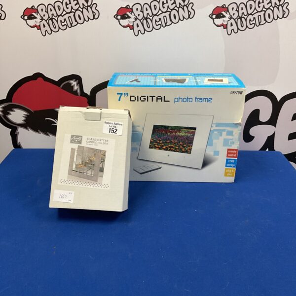 Digital photo frame and glass glitter candle holder lot for home display.
