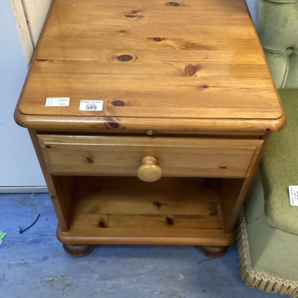 Vintage pine bedside cabinet with a single drawer.