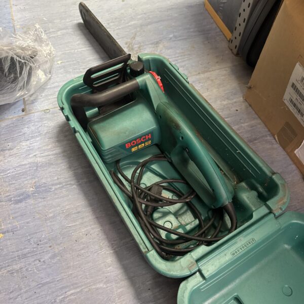 Used Bosch electric chainsaw for garden maintenance and DIY projects.