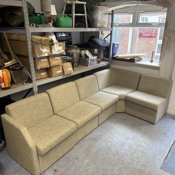 Vintage modular corner sofa in a waiting room setting.