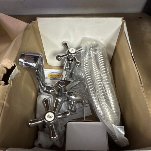 Chrome shower mixer tap with rounded handles, vintage bathroom fixture.