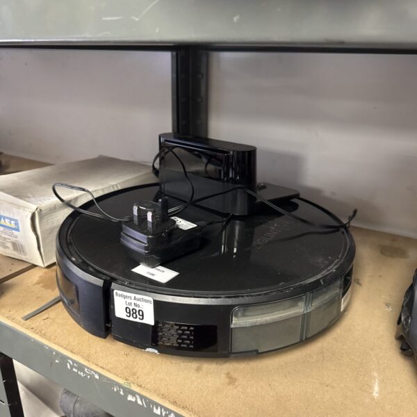 Ziglint robot vacuum cleaner with charging cradle, side view.