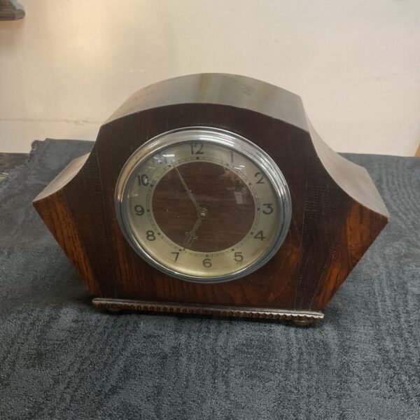 Vintage art deco mantle clock with wooden case.
