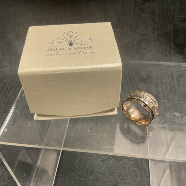 Silver spinner ring with a single rotating band.