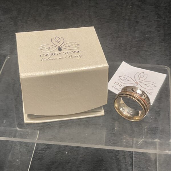 Silver Energy Stone spinner ring with double tree design.