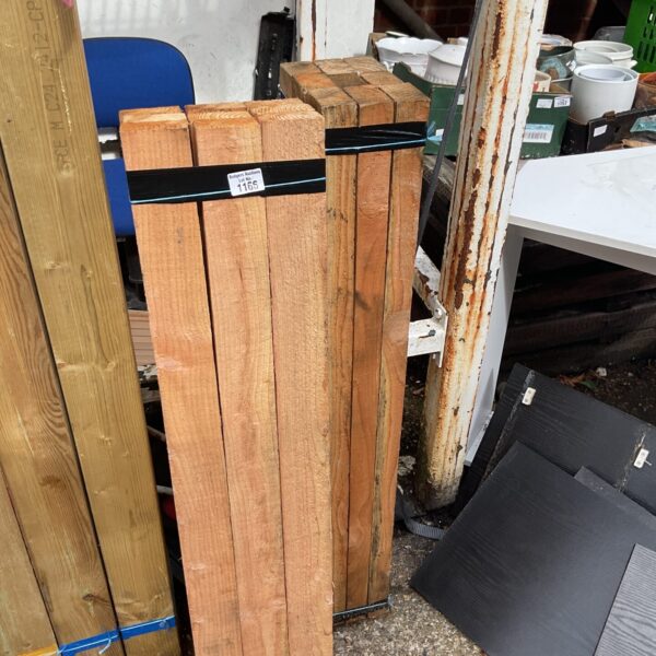 Stacked bundles of 3’6” timber for construction projects.