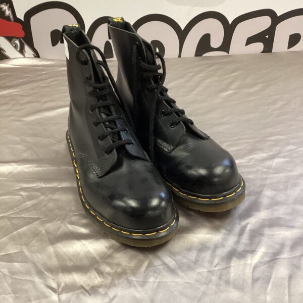 Black leather Dr Martens 1460 boots size 42, classic and durable footwear.