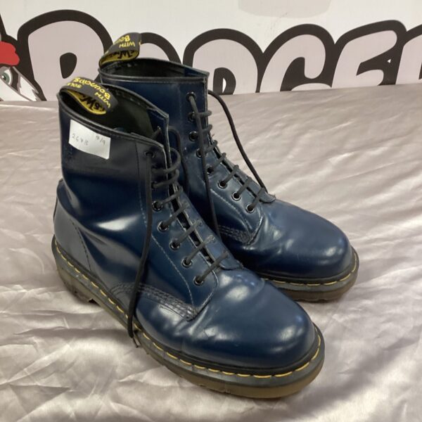 Blue Dr Martens boots in excellent condition, classic leather footwear.