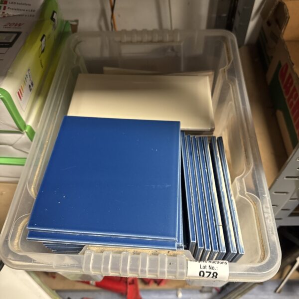 Mixed lot of blue ceramic tiles for DIY projects.