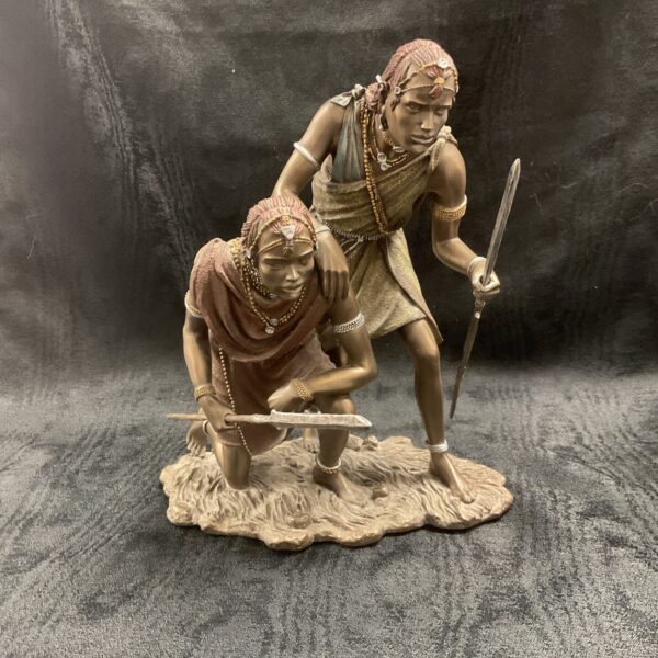 Detailed Maasai statue depicting a dramatic moment with two figures.
