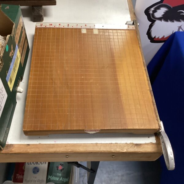 Vintage Ambassador paper cutter with grid pattern for precise trimming.