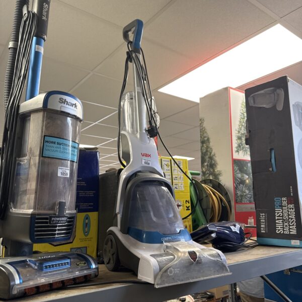Vax Compact Power carpet cleaner in a home setting.